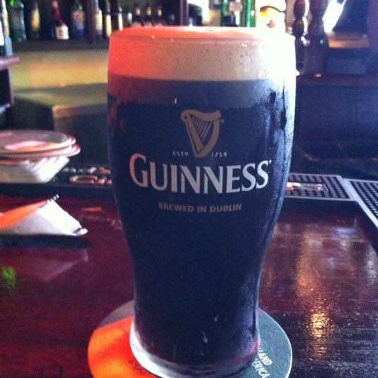 Photo taken at Slainte Irish Pub + Kitchen by Jim T. on 6/29/2012