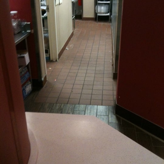 The kitchen floor looks filthy.