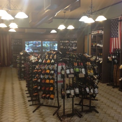 Photo taken at Fine Wines &amp; Liquors 11211 by Pierre L. on 9/10/2012
