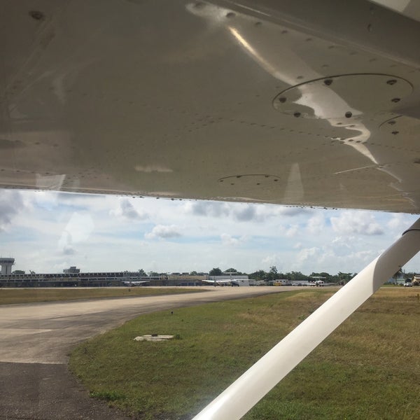 Photo taken at Philip S.W. Goldson International Airport (BZE) by Ramon R. on 3/19/2015