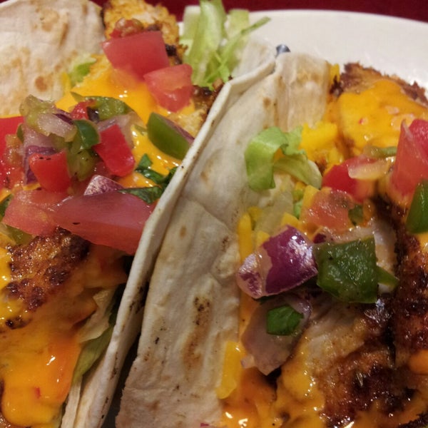 Fish tacos rock. No cabbage, just lettuce. Also sort of a spicy yellow sauce on blackened chicken makes these some of the best fish tacos I've ever had. The flour tortillas are slightly crispy