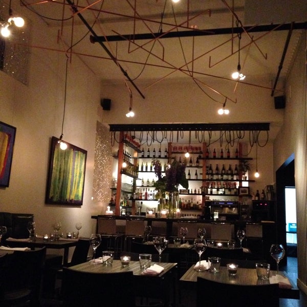 Photo taken at Monsieur Restaurant + Bar by Laura W. on 6/27/2014