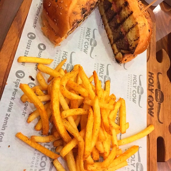 Photo taken at Holy Cow Gourmet Burgers &amp; Steakhouse by Melek C. on 10/1/2017