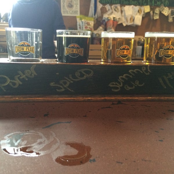 Photo taken at Crow Peak Brewing Company by Drew V. on 5/17/2015