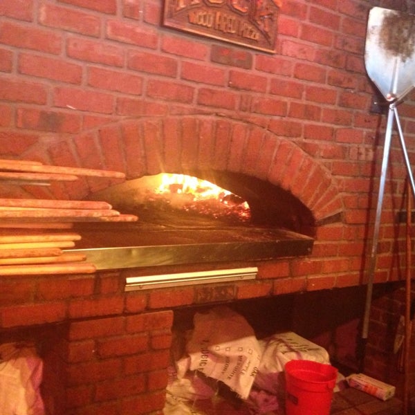 Photo taken at The Rock Wood Fired Pizza by Erin S. on 6/28/2013