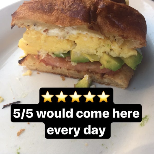 Get the breakfast sandwich on a croissant with goat cheese, tomato, and avocado.