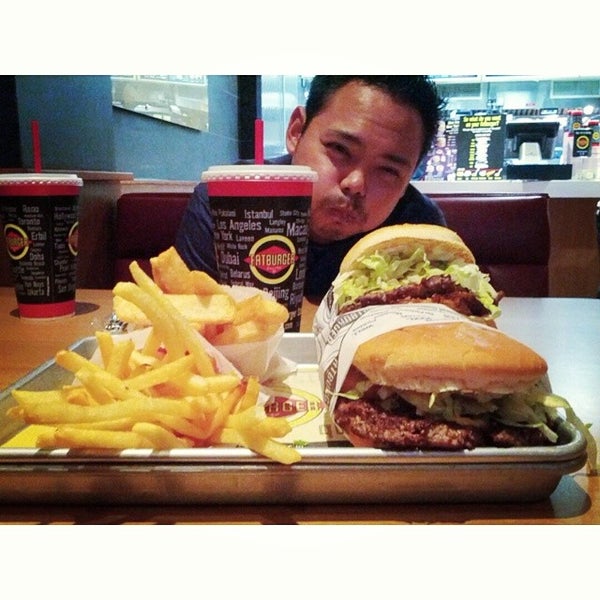 Photo taken at Fatburger by Jesse L. on 7/1/2014