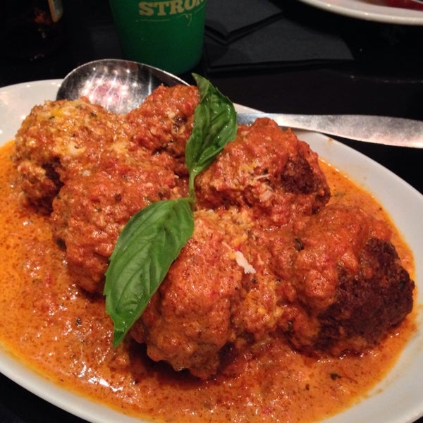 Come for their signature meatballs, generously sized and served in a vodka or marinara sauce, as well as their wood-fired pizzas. The clam slice is a must-order.