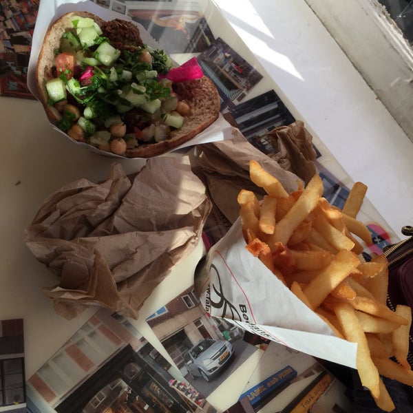 Great falafel. Cooked to perfection. Love that you can do your own toppings. The eggplant is amazing and the garlic cream. Definitely only order one fries between two. Grab a table when you can.