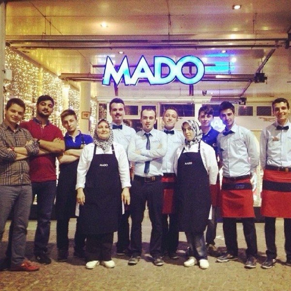 Photo taken at Mado Cafe by Emrah S. on 6/4/2015