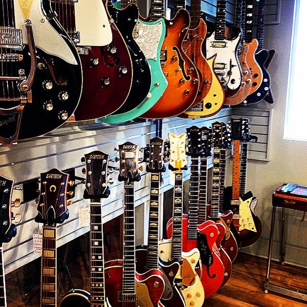 Photo taken at Gruhn Guitars by Trey S. on 10/13/2014