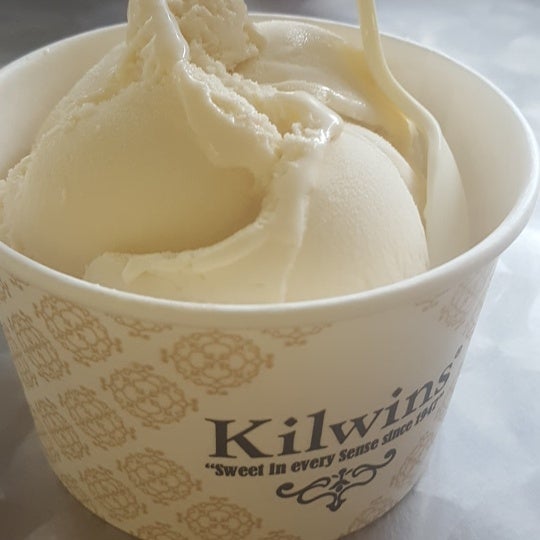 Photo taken at Kilwins Ice Cream by Tomas C. on 7/4/2017