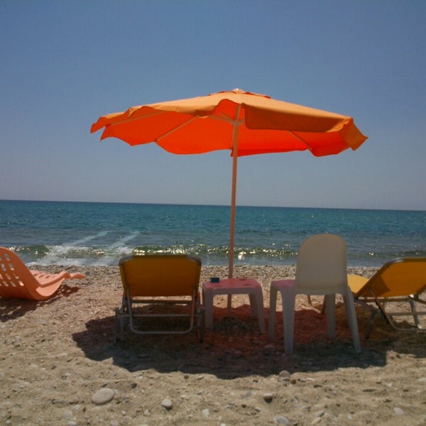 Photo taken at Stelakis Beach by Denitsa P. on 8/7/2013