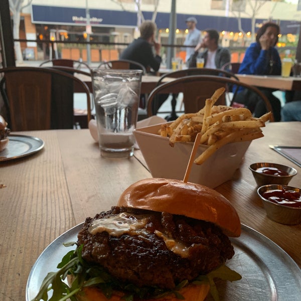 Photo taken at Stout Burgers &amp; Beers by A.M.T on 4/3/2019