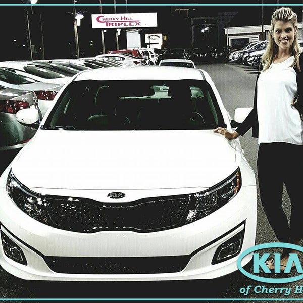 Mrs. Wallace just treated herself to a 2015 Kia Optima courtesy of salesperson Travis Kirsch.