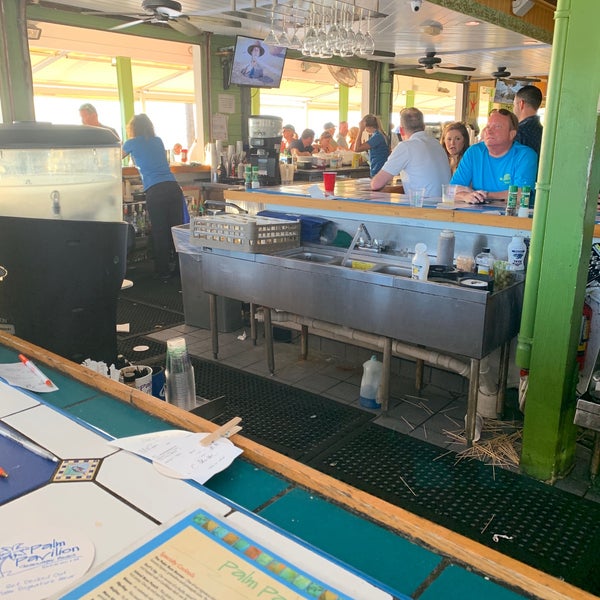 Photo taken at Palm Pavilion Beachside Grill &amp; Bar by Nicole W. on 4/16/2019