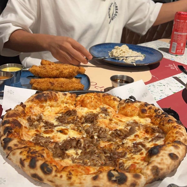 Photo taken at 8portions Pizza by A. i. on 5/12/2024