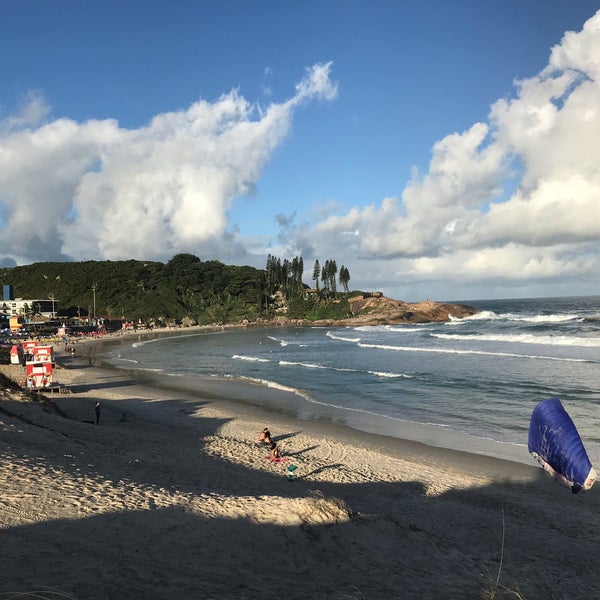 Photo taken at Praia da Joaquina by Milton J. on 3/29/2019