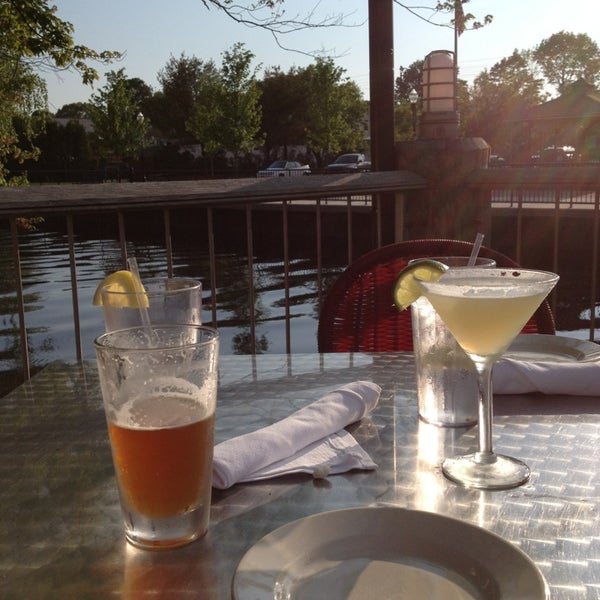 Photo taken at Bridge Restaurant [Raw Bar] and River Patio by Aaren S. on 5/21/2013