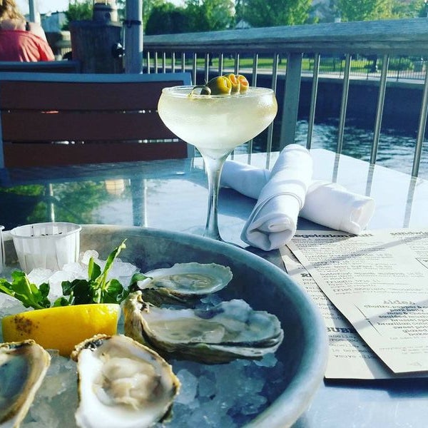 Photo taken at Bridge Restaurant [Raw Bar] and River Patio by user174570 u. on 3/13/2020