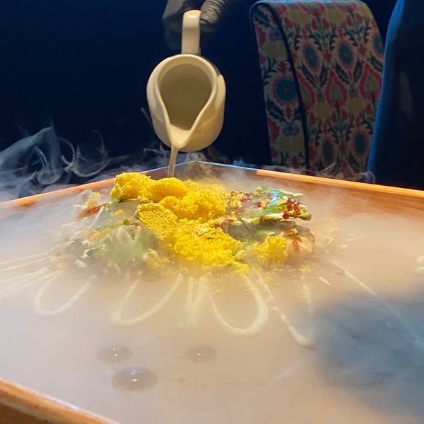 A cold appetizer prepared with dry ice infront of us.