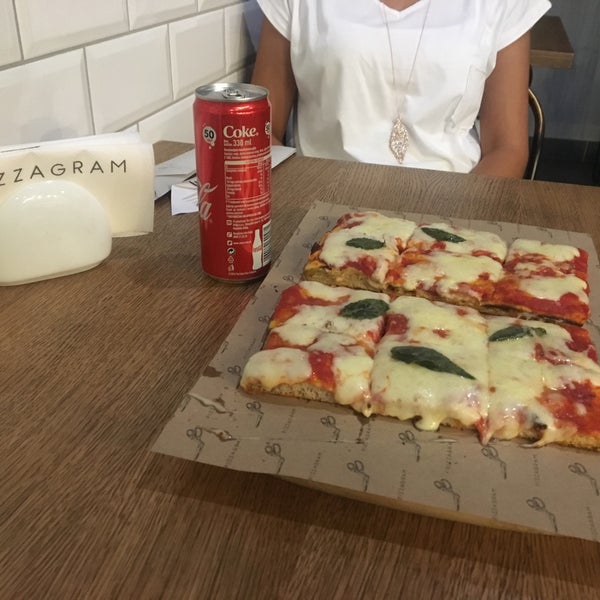 Very small but tasty shop.For 2 people margarita and coke is 400 rsd.The pizza is very delicious and crispy.