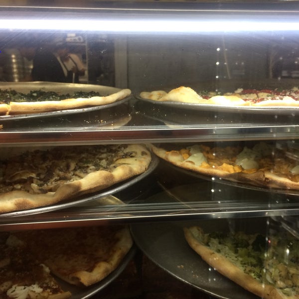 Photo taken at Justino&#39;s Pizzeria by Luis H. on 9/19/2015