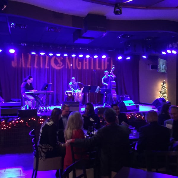 Photo taken at Jazziz Nightlife by Andrew B. on 12/19/2014