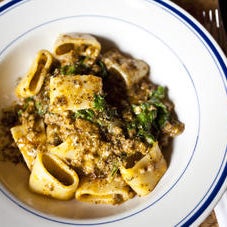 Toothsome anelloni rings are tossed in a generous jumble of wilted mustard greens and house-made spicy lamb sausage, while a soothing mac and cheese features cannolicchi curls gooey. -TimeOut
