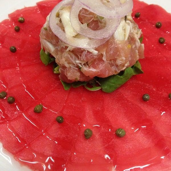 Ahi tuna carpaccio with tuna tar tar salad of jumbo lump crab, shaved red onion, capers and white truffle oil