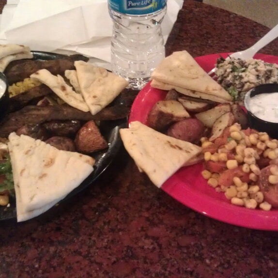 Photo taken at Poccadio Moroccan Grill &amp; Sandwiches by Rachael B. on 4/13/2013