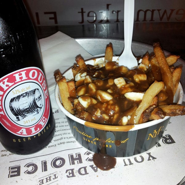 Grab a poutine and a beer after a long day of shopping for expensive crap