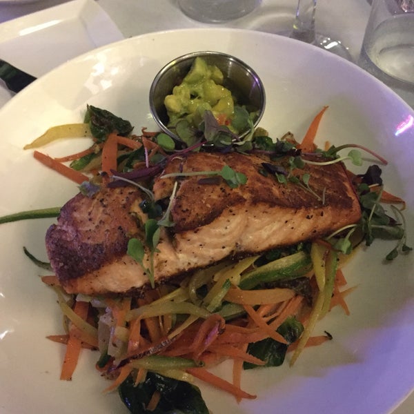 Photo taken at FISH Restaurant + Bar by jennifer y. on 8/4/2018