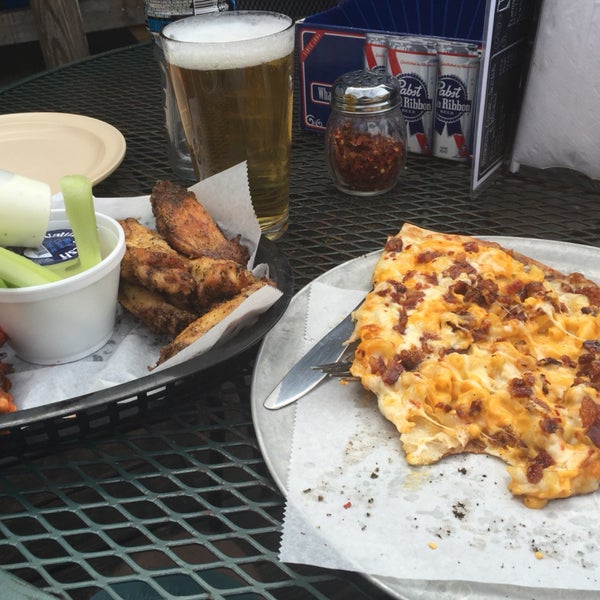 The honey bourbon and lemon pepper wings are awesome - as is all of their slices of pizza. You really can't go wrong. And $4 pitchers of High Life!