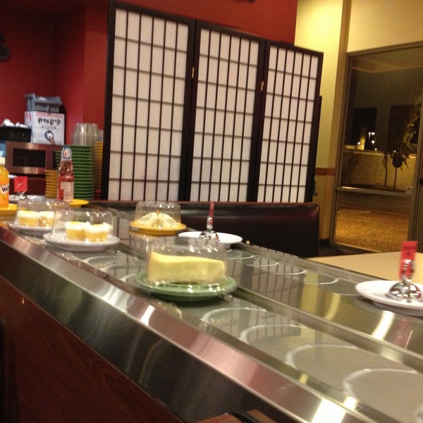Photo taken at KiKu Revolving Sushi by Michelle C. on 4/18/2013