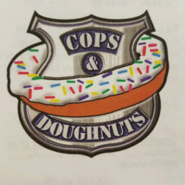 Photo taken at Cops &amp; Doughnuts Bakery by Ginger K. on 4/11/2017