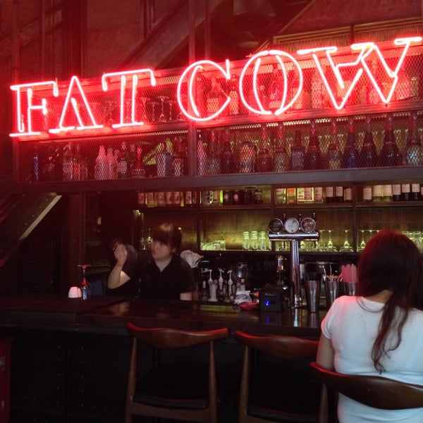 Photo taken at Fat Cow Burgers by Sandy T. on 6/23/2014