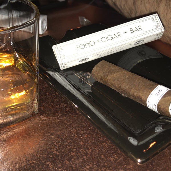 Photo taken at SoHo Cigar Bar by Özgür K. on 5/11/2018