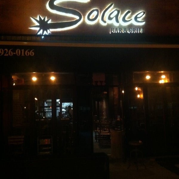Photo taken at Solace Bar &amp; Grill by Mike N. on 6/19/2013
