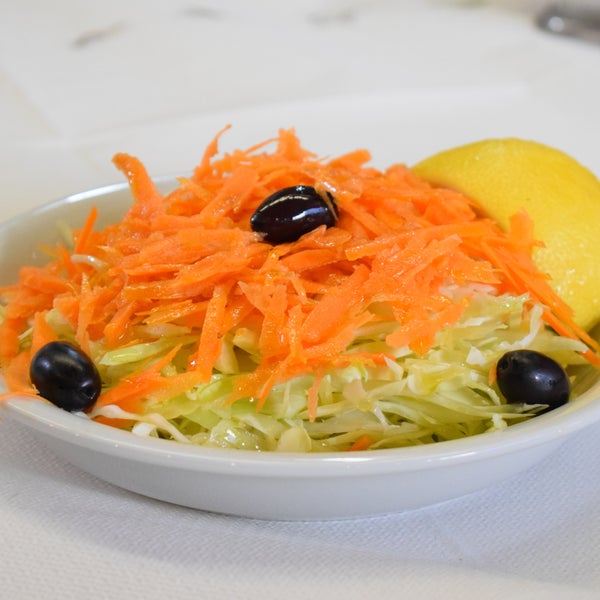 Healthy and fresh greek cabbage salad with carrots and olives! All our salads are made with local and natural ingredients!! Visit us for a great lunch  in the Center of Athens!