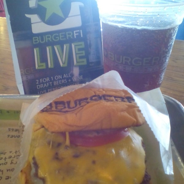 Photo taken at BurgerFi by Marcos D. on 5/5/2016