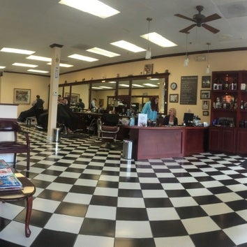 Photo taken at Gino&#39;s Classic Barber Shoppe by Paddy M. on 5/9/2014