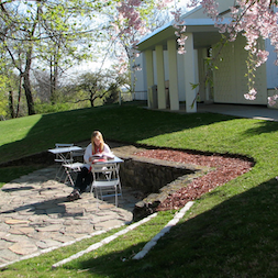 On warm days, readers and writers can now flock outside to our new patio area, which was designed by landscape architect Jan Johnsen. A friend of the library has donated café tables and chairs.