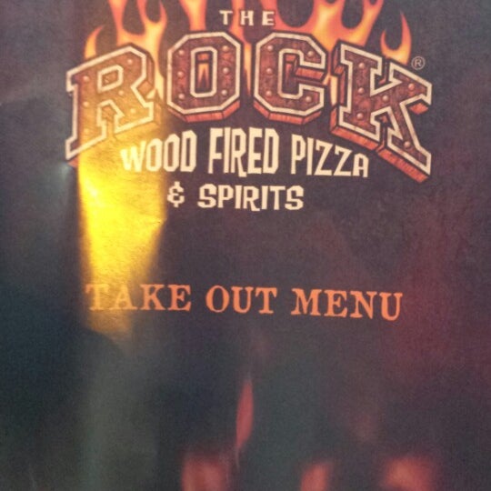 Photo taken at The Rock Wood Fired Pizza by Susan C. on 7/28/2013