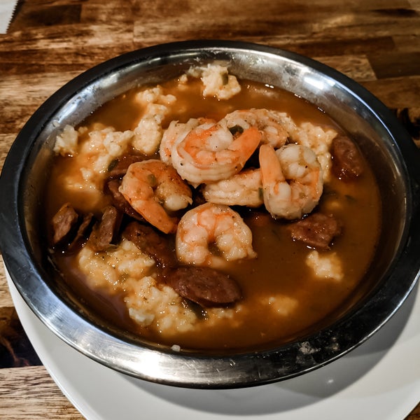 This place honestly deserves a higher rating. I got in right before they closed and the staff was super friendly. Shared the shrimp and grits and chicken and waffles - most popular dishes for a reason