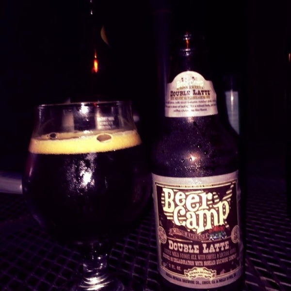 Photo taken at Backyard Beer Cellar by Kelly V. on 9/7/2014