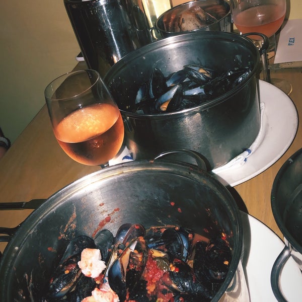 Got the number 23 mussels of the day and the lobster mussels in a red sauce (asked for them cooked without butter) - both were amazing! The cocktails were okay and the donuts are a must!