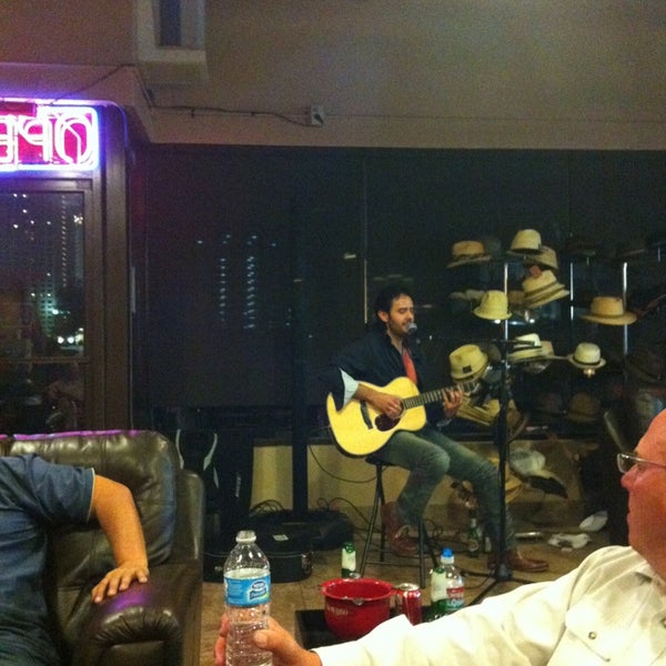 Photo taken at En Fuego Cigars &amp; Lounge by Kevin M. on 3/23/2013