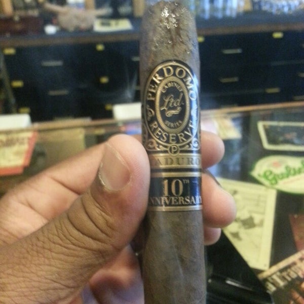 Photo taken at Crown Cigars and Ales by Parvin M G. on 5/9/2013