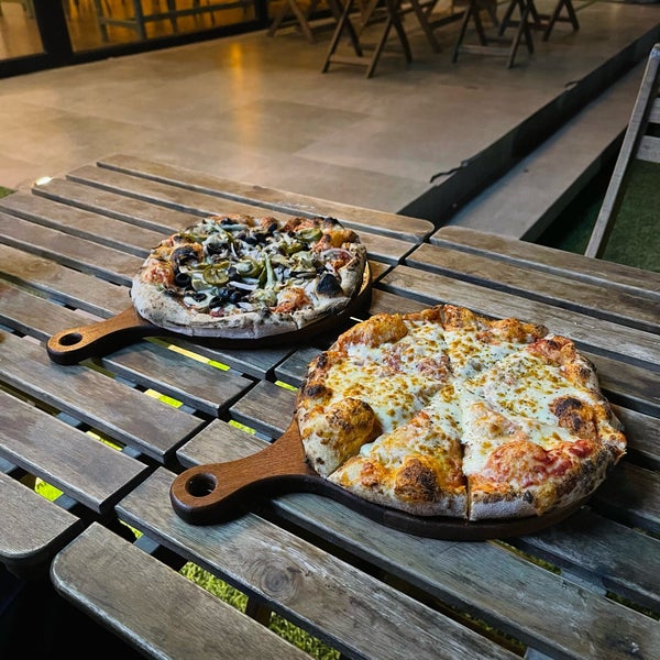 Photo taken at Mozzafiato Pizzeria by zahraXHM on 5/21/2022